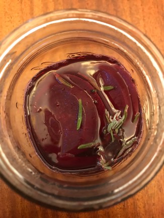 a view of a jark of pickled beets from above